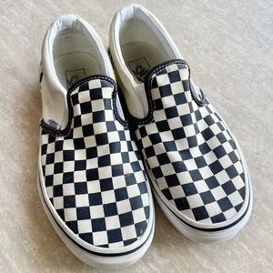 Kids’ checkerboard Vans slip ons